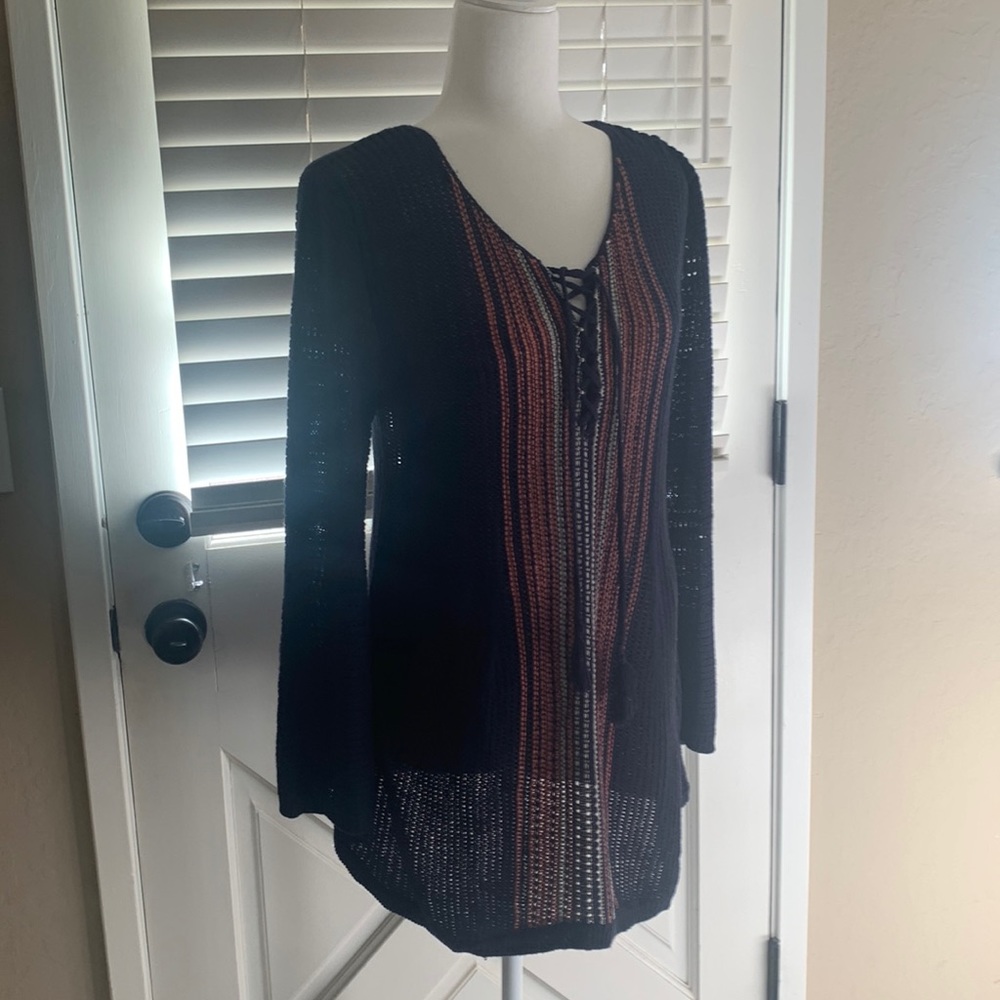 Tunic-length knit sweater, lightweight, a bit sheer so cami required, never worn